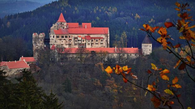 Beautiful old castle in forests with autumn landscape. Castle Pernstejn - Nedvedice. Europe Czech Republic.