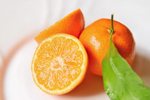 Beautiful fresh fruit - tangerine. Isolated on a clean background.