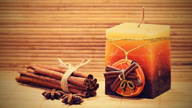 Cinnamon and star anise on a wooden background. Beautiful and fragrant spices for Christmas time and winter cooking season.