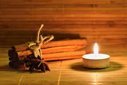 Cinnamon and star anise on a wooden background. Beautiful and fragrant spices for Christmas time and winter cooking season.