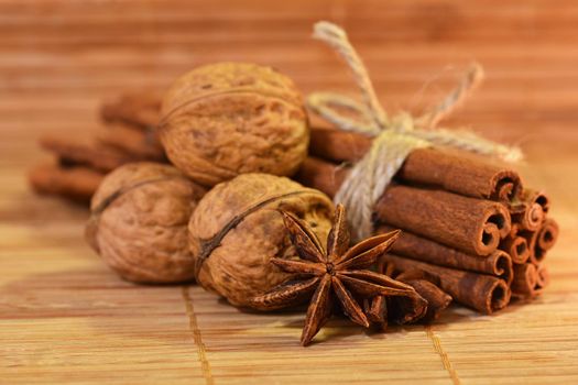 Cinnamon and star anise on a wooden background. Beautiful and fragrant spices for Christmas time and winter cooking season.