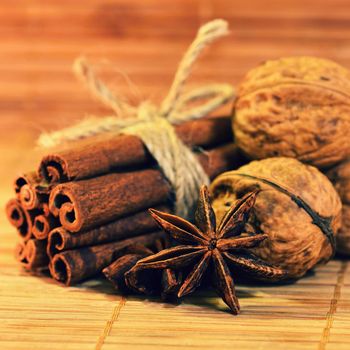 Cinnamon and star anise on a wooden background. Beautiful and fragrant spices for Christmas time and winter cooking season.