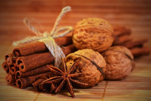 Cinnamon and star anise on a wooden background. Beautiful and fragrant spices for Christmas time and winter cooking season.