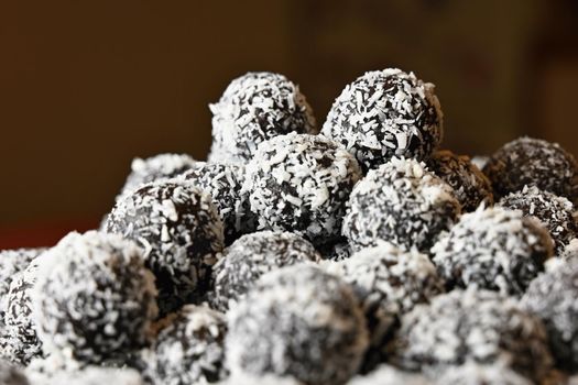 Rum balls. Traditional Czech Christmas cookies. Cocoa coated in coconut.