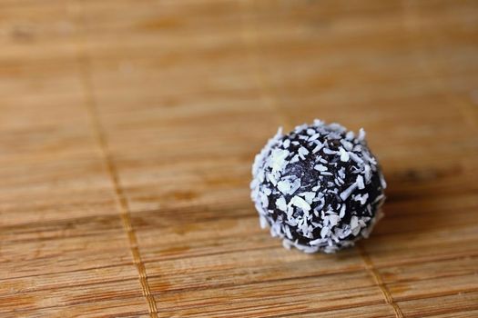 Rum balls. Traditional Czech Christmas cookies. Cocoa coated in coconut.