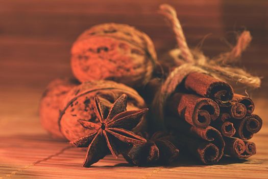 Cinnamon and star anise on a wooden background. Beautiful and fragrant spices for Christmas time and winter cooking season.