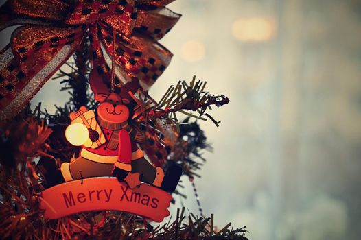 Christmas. Beautiful Christmas ornament on the Christmas tree. Seasonal background for winter holidays.