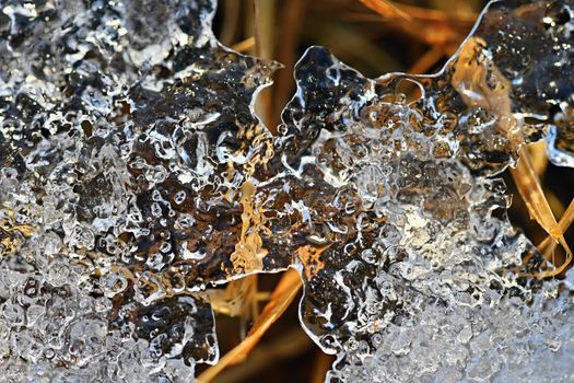 Macro shot of ice on a creek. Natural winter background.