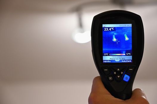 Hand thermal imaging camera to check temperature .