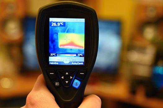 Hand thermal imaging camera to check temperature .