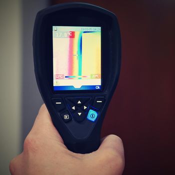 Hand thermal imaging camera to check temperature .