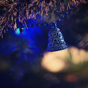 Christmas. Beautiful Christmas ornament on the Christmas tree. Seasonal background for winter holidays.