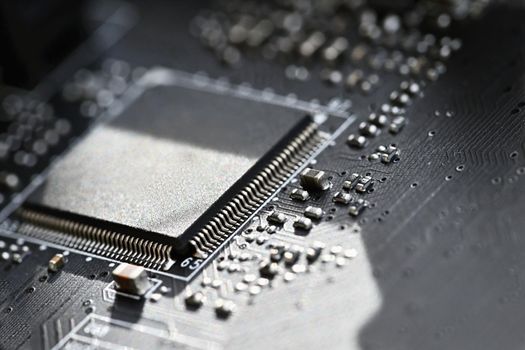 Printed Circuit Board with electrical components. Background concept for electrical engineering and modern technology