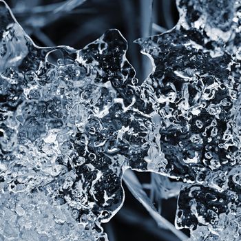 Macro shot of ice on a creek. Natural winter background.