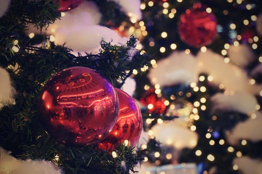 Christmas and New Year holidays background, winter season. Christmas greeting card with ornaments and lights for tree.
