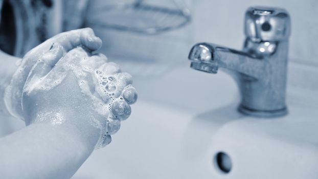 Thorough hand washing with disinfectant soap. Quarantine - domestic hygiene. Measures against coronavirus disease. (COVID-19)