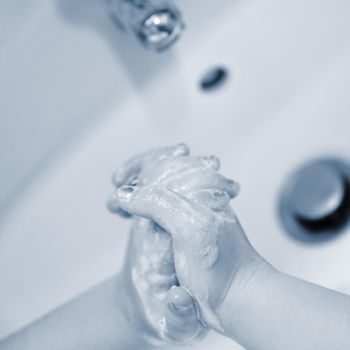 Thorough hand washing with disinfectant soap. Quarantine - domestic hygiene. Measures against coronavirus disease. (COVID-19)