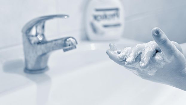 Thorough hand washing with disinfectant soap. Quarantine - domestic hygiene. Measures against coronavirus disease. (COVID-19)