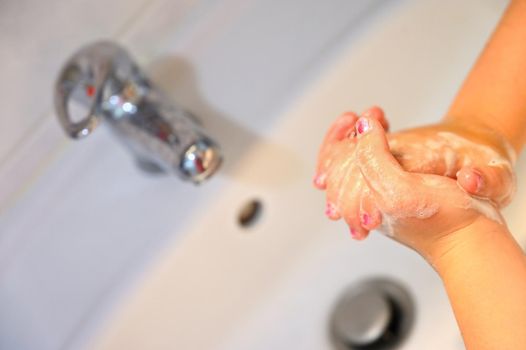 Thorough hand washing with disinfectant soap. Quarantine - domestic hygiene. Measures against coronavirus disease. (COVID-19)
