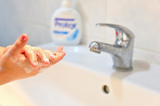 Thorough hand washing with disinfectant soap. Quarantine - domestic hygiene. Measures against coronavirus disease. (COVID-19)