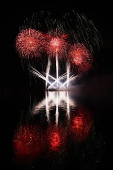 Beautiful colorful fireworks with reflections in water. Brno dam, the city of Brno-Europe. International Fireworks Competition.