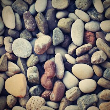 Beautiful colorful stones by the sea on the beach.