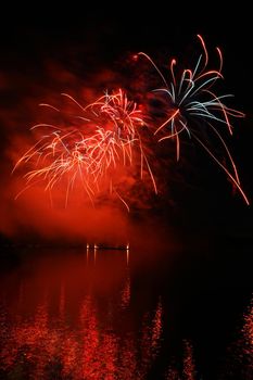 International competition of fireworks over the water surface. Brno Dam-Czech Republic-Brno. Beautiful colorful abstract fireworks. Concept for celebrations and holidays.