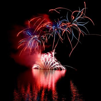 International competition of fireworks over the water surface. Brno Dam-Czech Republic-Brno. Beautiful colorful abstract fireworks. Concept for celebrations and holidays.