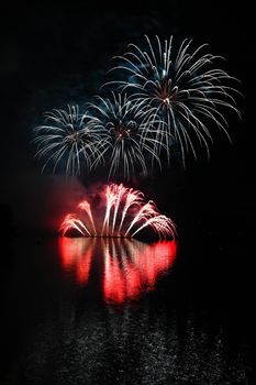 International competition of fireworks over the water surface. Brno Dam-Czech Republic-Brno. Beautiful colorful abstract fireworks. Concept for celebrations and holidays.