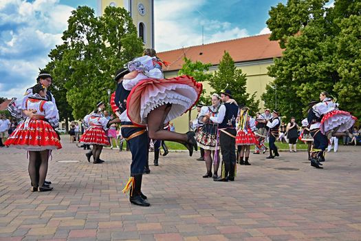 Brno - Bystrc, Czech Republic, June 22, 2019. Traditional Czech feast. Folk Festival. Girls and boys dancing in beautiful costumes. An old Christian holiday, a day of abundance, joy and prosperity.