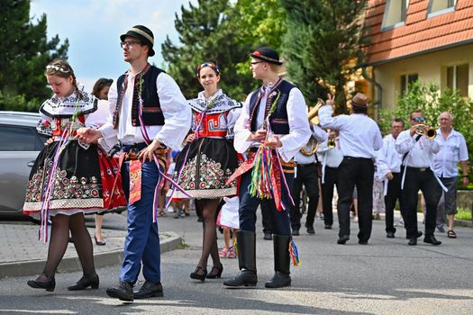 Brno - Bystrc, Czech Republic, June 22, 2019. Traditional Czech feast. Folk Festival. Girls and boys dancing in beautiful costumes. An old Christian holiday, a day of abundance, joy and prosperity.