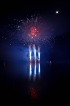 Firework. Beautiful colorful fireworks on the water surface with a clean black background. Fun festival and contest of Firefighters  Brno Dam - Czech Republic.