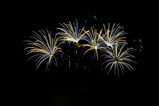 Firework. Beautiful colorful fireworks on the water surface with a clean black background. Fun festival and contest of Firefighters  Brno Dam - Czech Republic.