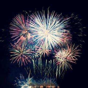 Firework. Beautiful colorful fireworks on the water surface with a clean black background. Fun festival and contest of Firefighters  Brno Dam - Czech Republic.