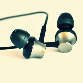 Headphones - small black balls. Isolated on a clean white background.
