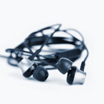 Headphones - small black balls. Isolated on a clean white background.