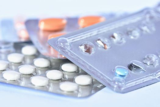 Drugs or vitamins in tablets. Packaging blister. Isolated on a white background.
Concept for health and medicine.