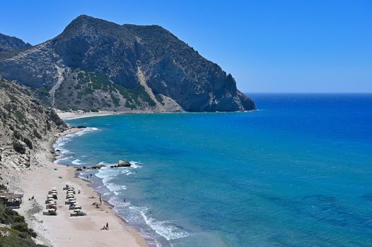 Beautiful beach with sea in tourist resort. Greece island Kos. Beautiful concept for summer vacation. Natural colorful background.