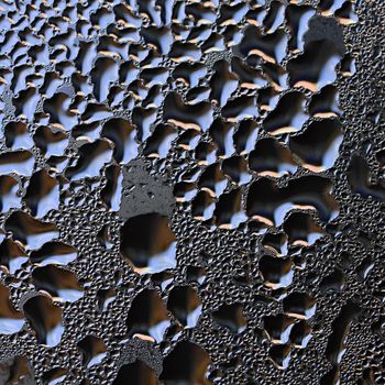 Colorful abstract background. Beautiful macro shot of water drops on a window.