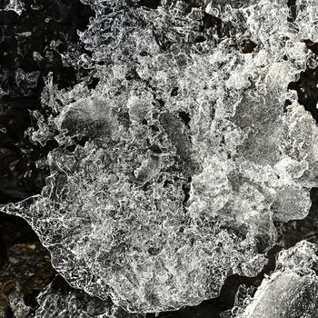 Macro shot of ice on a creek. Natural winter background.