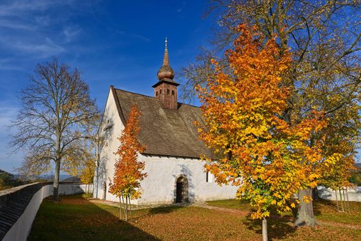 Beautiful autumn landscape with old Chapel of the Mother of God in Veveří. Sunset and beautiful blue sky with clouds. Colorful nature background on autumn season. Brno - Czech Republic.