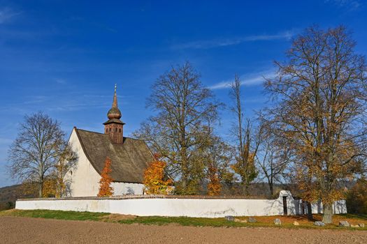 Beautiful autumn landscape with old Chapel of the Mother of God in Veveří. Sunset and beautiful blue sky with clouds. Colorful nature background on autumn season. Brno - Czech Republic.