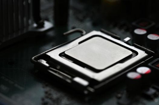 Beautiful technological photo of the processor on the motherboard. Concept for computers and internet.