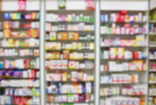 Blurred background. Interior of a pharmacy with goods and showcases. Medicines and vitamins for health. Shop concept, medicine and healthy lifestyle