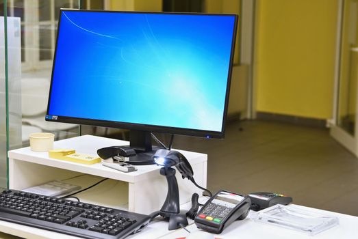 Empty cash desk with terminal in supermarket. Concept for business and sales.