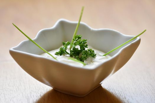 Great homemade tartar sauce in a bowl. Garnished with parsley.