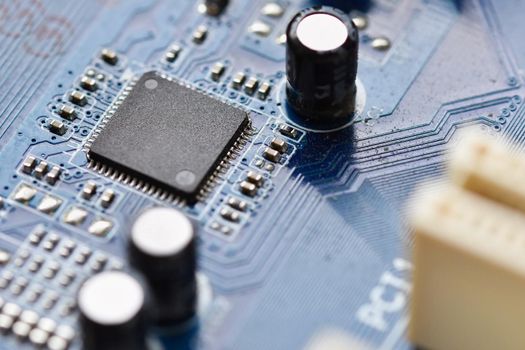 Components on board. PCB to PC. Chip, capacitor and connectors on the motherboard of a personal computer. Modern technological background.