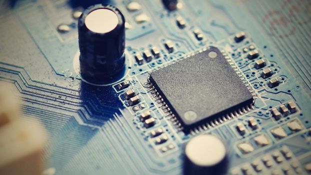 Components on board. PCB to PC. Chip, capacitor and connectors on the motherboard of a personal computer. Modern technological background.