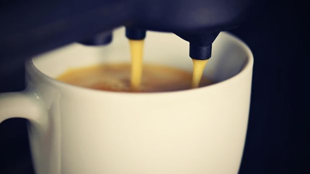 Coffee machine making espresso coffee. Morning cup of coffee for a good start of the day