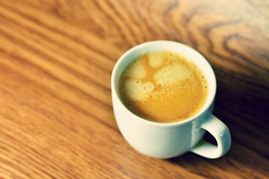 Fresh tasty espresso cup on background. Morning cup of coffee for a good start of the day
